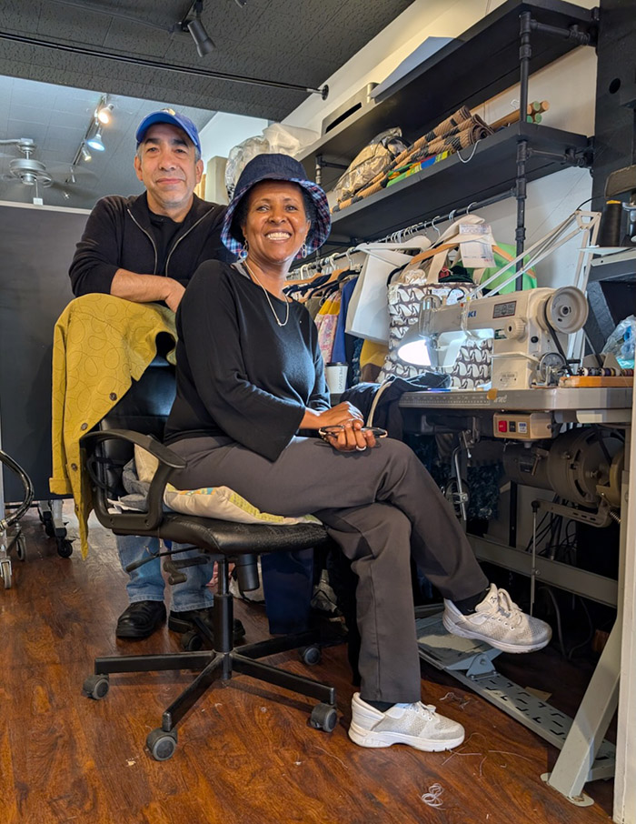 Man and woman near sewing machine