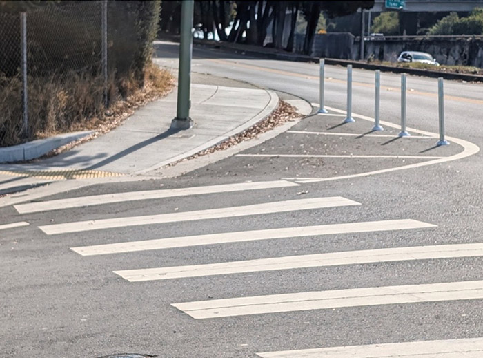 Plastic bollards and paint change a turning lane