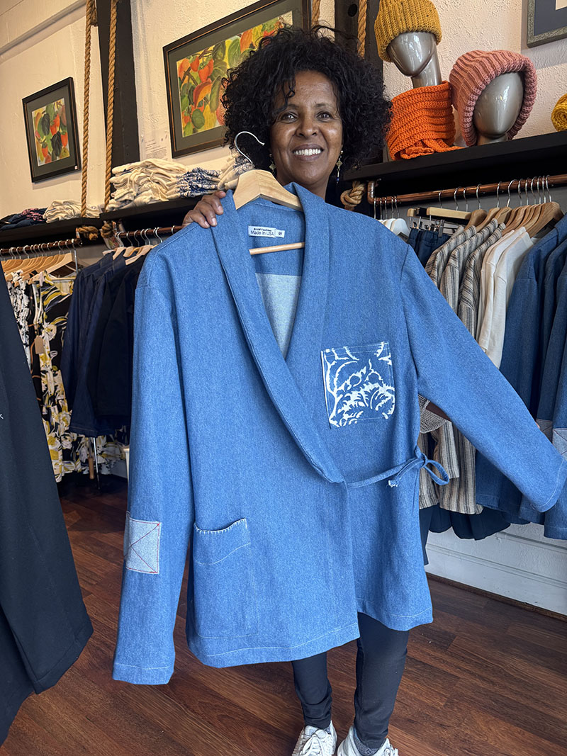 Woman holds up jacket