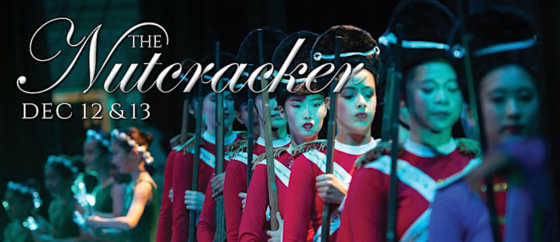 Nutcracker promo featuring severeal wmen in red costumes